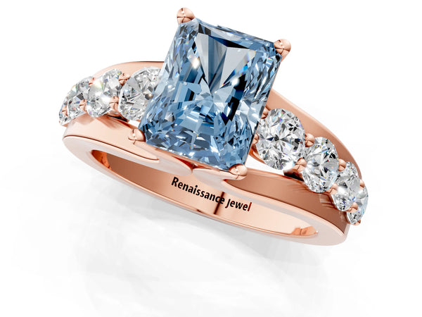 Rose gold Fancy Blue Radiant  Brilliant Solitaire with Side Stones on a Pave Band and Four-Prong Setting