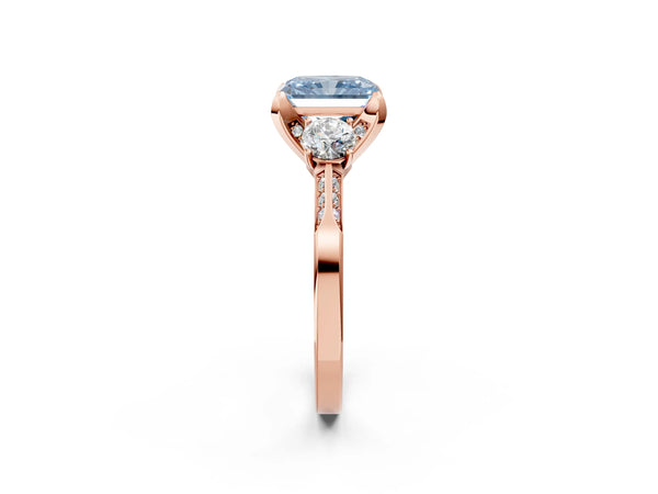 Rose gold Fancy Blue Radiant Cut Brilliant Three-Stone Diamond Ring with Pavé Band and Four-Prong Setting