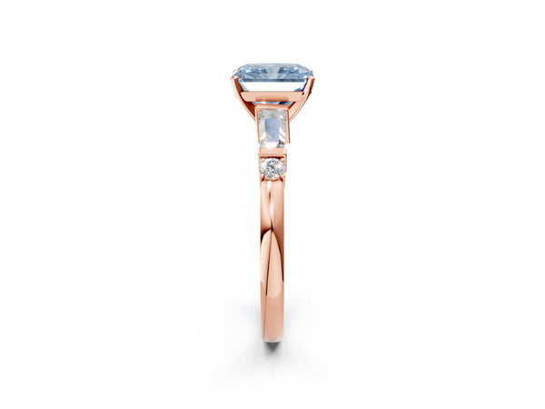 Rose gold Fancy Blue Radiant  Cut Diamond Ring with Baguette Side Stones, Channel Set Band, and Four-Prong Setting