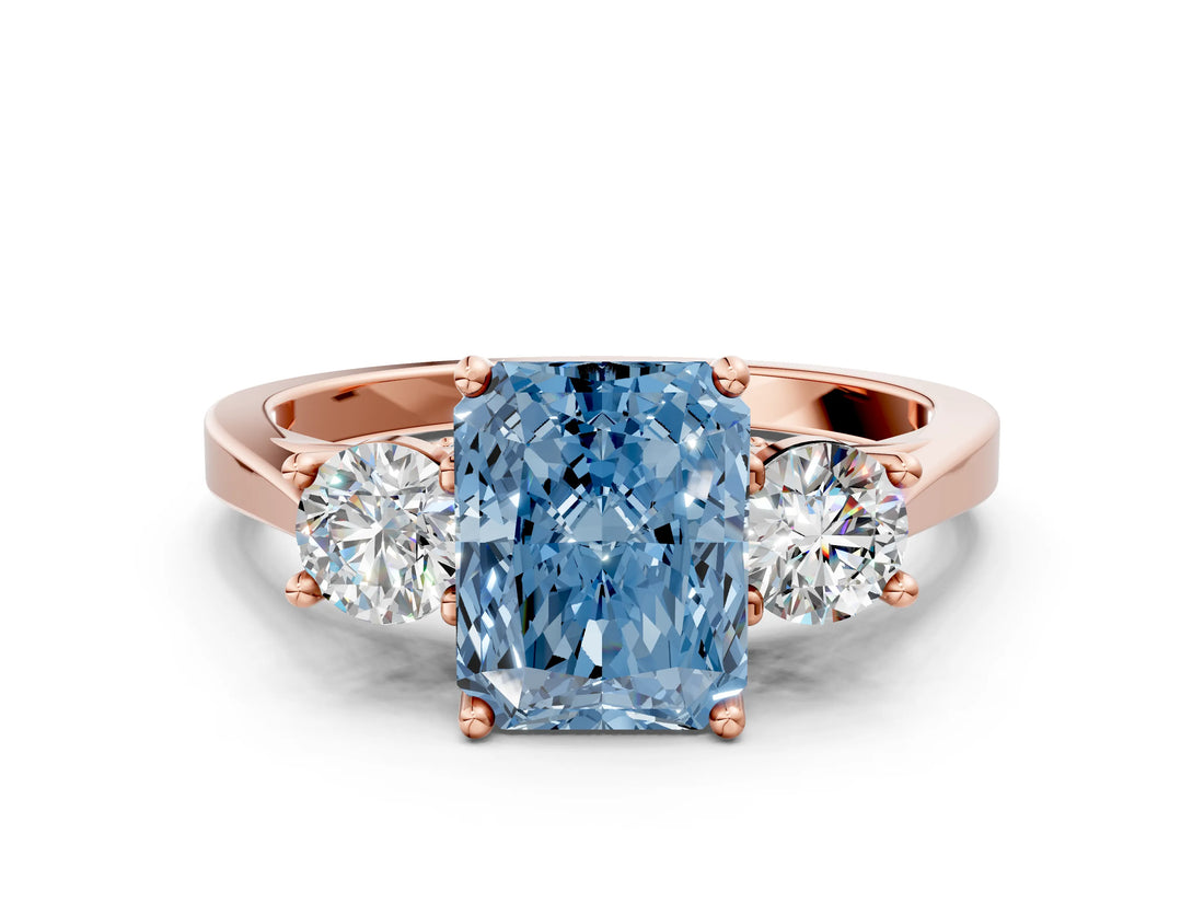 Rose gold Fancy Blue Radiant Cut Diamond Three-Stone Engagement Ring with Prong Setting and Pavé Band
