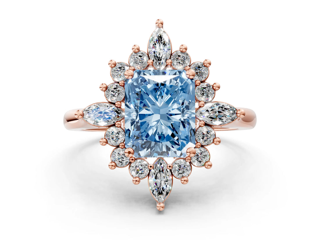 Rose gold Fancy Blue Radiant Cut Halo Diamond Cluster Ring with Marquise and Round Stones on a White Gold Band with Prong Setting