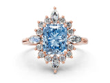 Rose gold Fancy Blue Radiant Cut Halo Diamond Cluster Ring with Marquise and Round Stones on a White Gold Band with Prong Setting