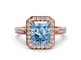 Rose gold Fancy Blue Radiant Cut Halo Diamond Engagement Ring with Split Shank Band and Four-Prong Setting