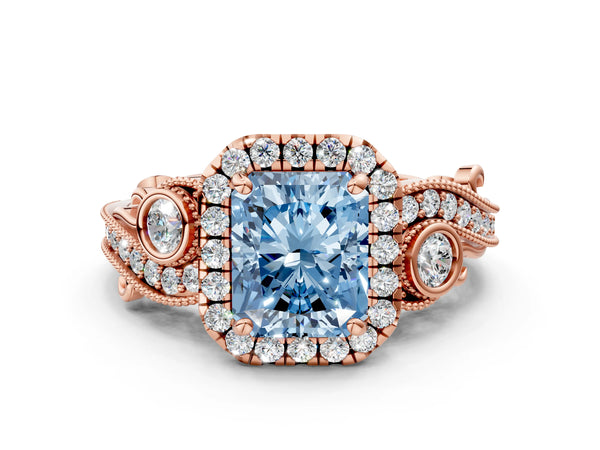 Rose gold Fancy Blue Radiant Cut Halo Diamond Ring with Milgrain and Bezel Accents on a Split Shank Band