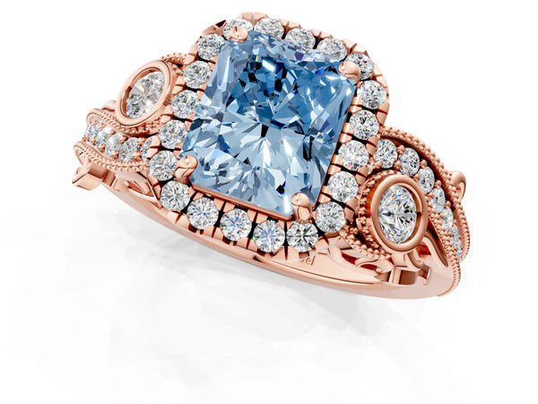 Rose gold Fancy Blue Radiant Cut Halo Diamond Ring with Milgrain and Bezel Accents on a Split Shank Band