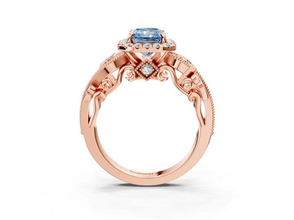 Rose gold Fancy Blue Radiant Cut Halo Diamond Ring with Milgrain and Bezel Accents on a Split Shank Band