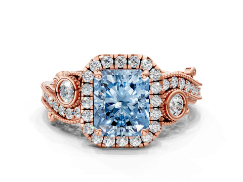 Rose gold Fancy Blue Radiant Cut Halo Diamond Ring with Milgrain and Bezel Accents on a Split Shank Band