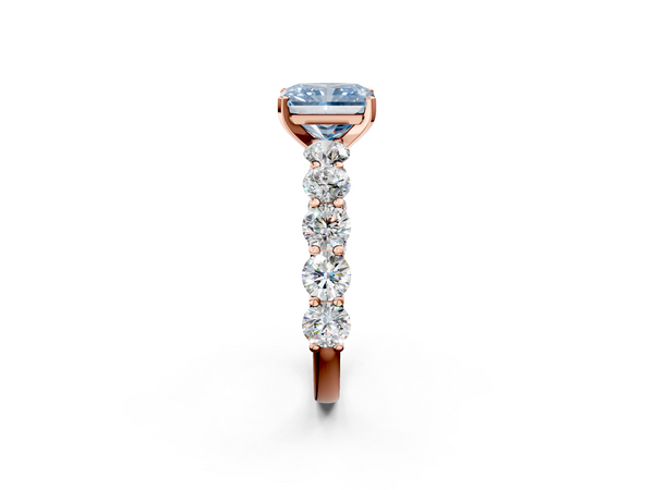 Rose gold Fancy Blue Radiant Cut Diamond Prong Setting with Side Stones on a Pave Band