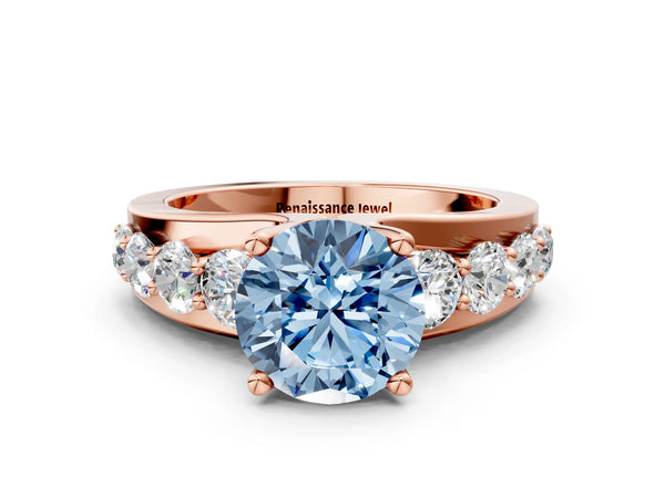 Rose gold Fancy Blue Round  Brilliant Solitaire with Side Stones on a Pave Band and Four-Prong Setting