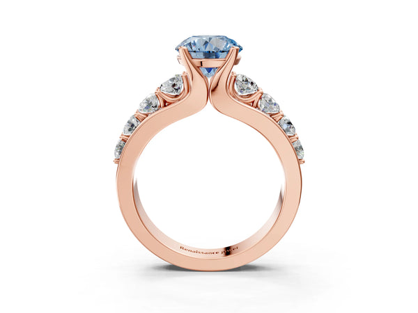 Rose gold Fancy Blue Round  Brilliant Solitaire with Side Stones on a Pave Band and Four-Prong Setting