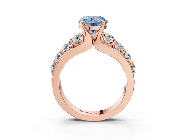 Rose gold Fancy Blue Round  Brilliant Solitaire with Side Stones on a Pave Band and Four-Prong Setting