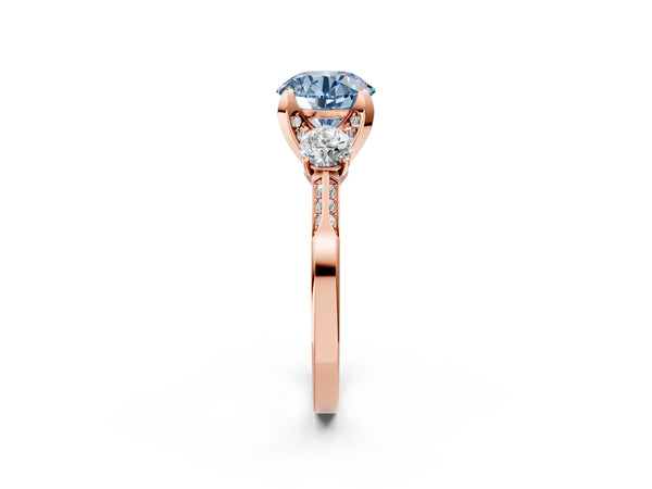 Rose gold Fancy Blue Round Cut Brilliant Three-Stone Diamond Ring with Pavé Band and Four-Prong Setting