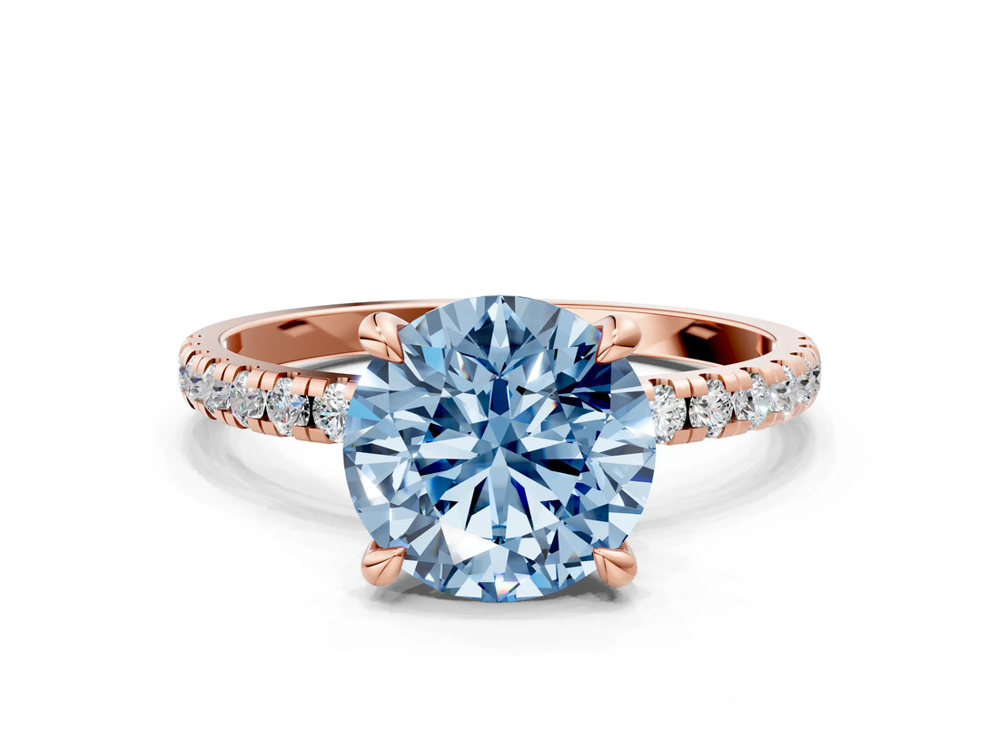 Rose gold Fancy Blue Round Cut Diamond Brilliant Solitaire Ring with Pavé Band and Four-Prong Setting