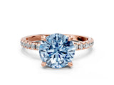 Rose gold Fancy Blue Round Cut Diamond Brilliant Solitaire Ring with Pavé Band and Four-Prong Setting