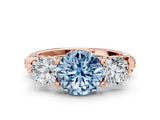 Rose gold Fancy Blue Round Cut Diamond Three-Stone Ring with Prong Setting and Pavé Band