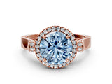 Rose gold Fancy Blue Round Cut Halo Round Diamond Twist Band with Four-Prong Setting
