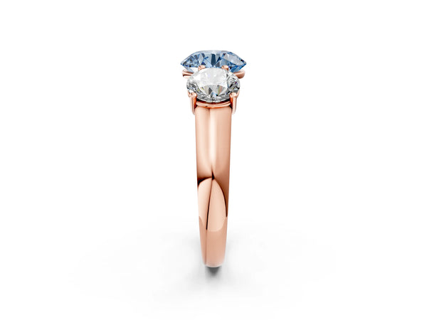 Rose gold Fancy Blue Round Cut Three-Stone Diamond Ring with Prong Setting on a Classic Band
