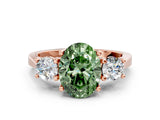 Rose gold Fancy Green Oval Cut Diamond Three-Stone Engagement Ring with Prong Setting and Pavé Band