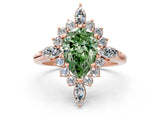 Rose gold Fancy Green Pear Cut Halo Diamond Cluster Ring with Marquise and Round Stones on a White Gold Band with Prong Setting