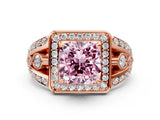 Rose gold Fancy Pink Cushion Cut Diamond Halo Ring with Split Shank and Bezel Accents and Four-Prong Setting