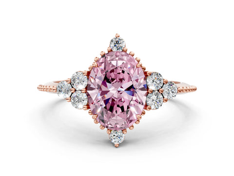 Rose gold Fancy Pink Oval Cut Brilliant Diamond with Cluster Setting on a Beaded Band and Four-Prong Setting