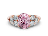 Rose gold Fancy Pink Oval  Cut Diamond Cluster Ring with Round Accent Stones and Prong Setting on a Classic Band_49
