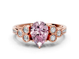 Rose gold Fancy Pink Pear  Cut Diamond Engagement Ring with Bezel Set Round Side Stones and Prong Setting_51