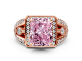 Rose gold Fancy Pink Radiant Cut Diamond Halo Ring with Split Shank and Bezel Accents and Four-Prong Setting