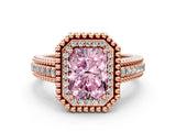 Rose gold Fancy Pink Radiant Cut Halo Diamond Ring with Beaded Split Shank and Four-Prong Setting