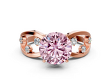 Rose gold Fancy Pink Round  Cut Solitaire Diamond with Side Stones on Criss-Cross Band and Four-Prong Setting