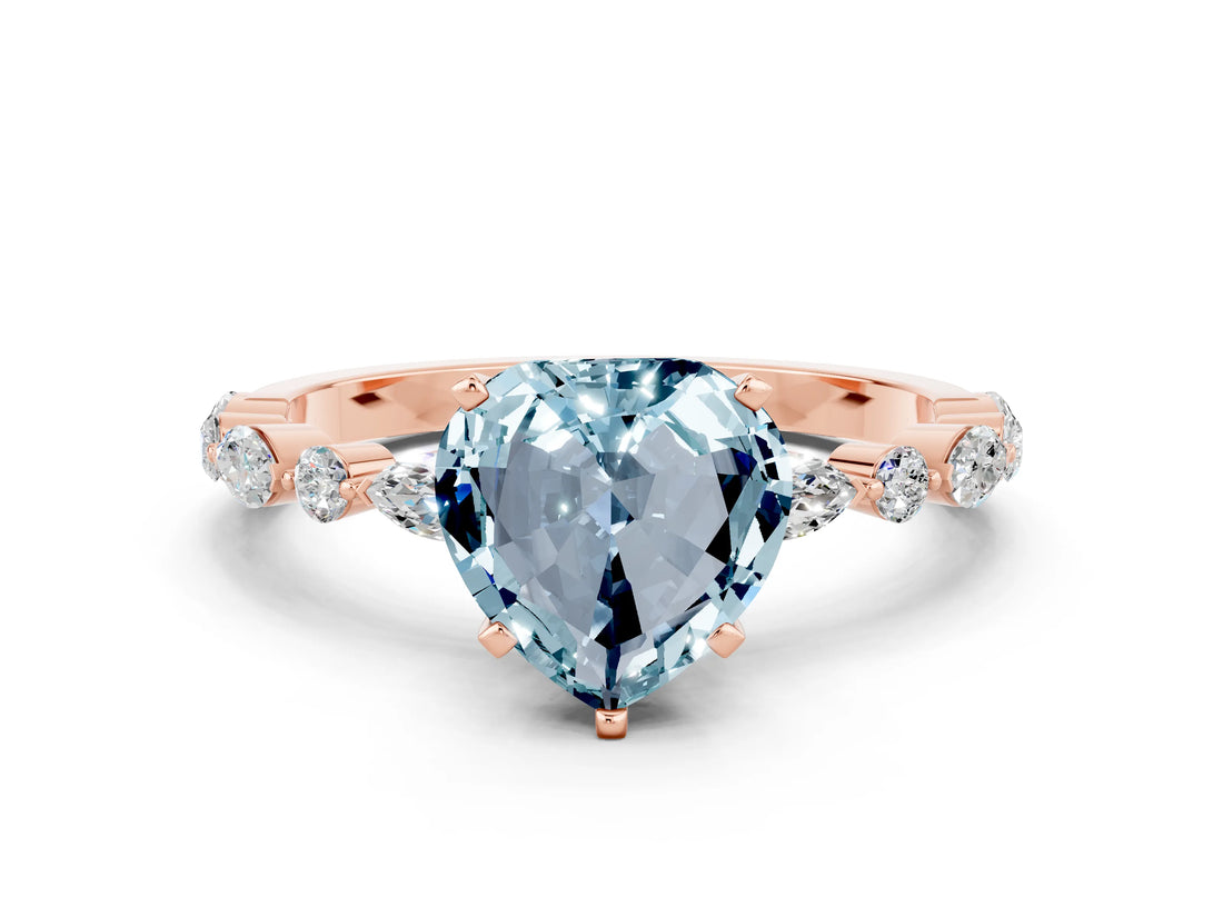 Rose gold Fancy White Heart Cut Aquamarine Solitaire with Side Stones on a Pavé Band and Four-Prong Setting