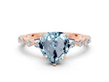 Rose gold Fancy White Heart Cut Aquamarine Solitaire with Side Stones on a Pavé Band and Four-Prong Setting