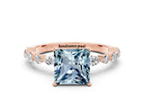 Rose gold Fancy White Princess Cut Aquamarine Solitaire with Side Stones on a Pavé Band and Four-Prong Setting