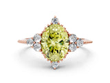 Rose gold Fancy Yellow Oval Cut Brilliant Diamond with Cluster Setting on a Beaded Band and Four-Prong Setting