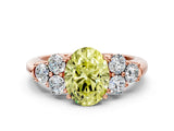 Rose gold Fancy Yellow Oval  Cut Diamond Cluster Ring with Round Accent Stones and Prong Setting on a Classic Band_51