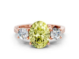 Rose gold Fancy Yellow Oval Cut Diamond Three-Stone Engagement Ring with Prong Setting and Pavé Band