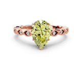 Rose gold Fancy Yellow Pear Cut Solitaire Diamond Ring with Infinity Twist Band and Four-Prong Setting
