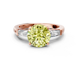 Rose gold Fancy Yellow Round  Solitaire with Tapered Baguette Side Stones on a Classic Band with Four-Prong Setting