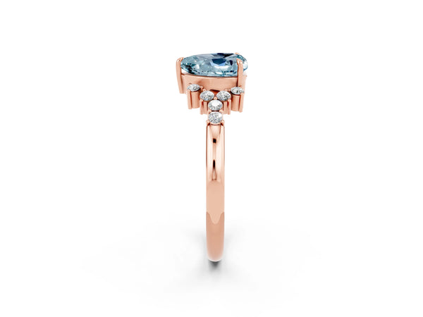 Rose gold Heart Cut Aquamarine Ring with Side Stones and Four-Prong Setting