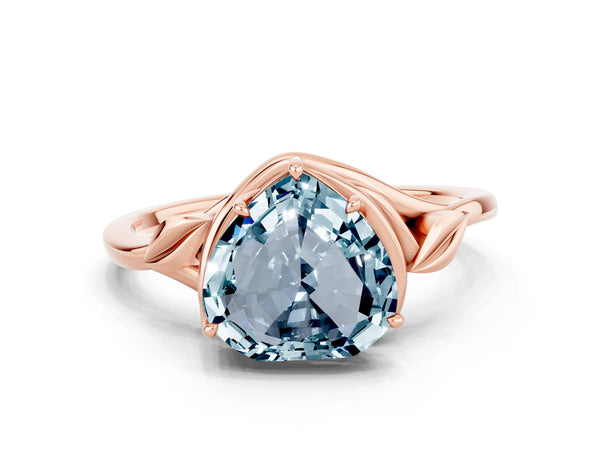 Rose gold Heart Cut Aquamarine Solitaire Ring with Twist Band and Four-Prong Setting