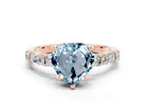 Rose gold Heart Cut Aquamarine Solitaire with Side Baguettes and Channel Set Band