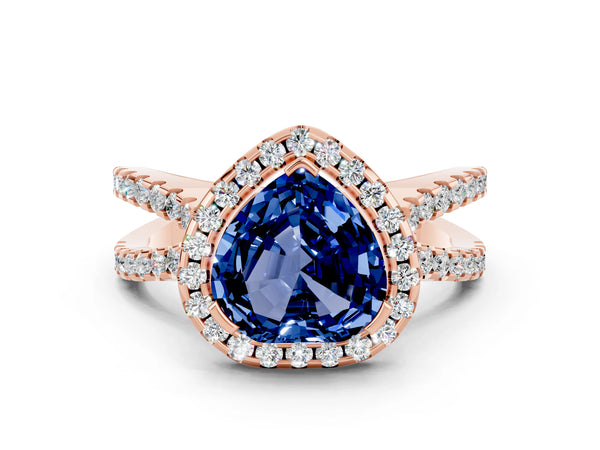 Rose gold Heart Cut Blue Sapphire Halo Ring with Split Shank Pavé Band and Prong Setting