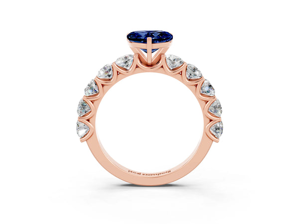 Rose gold Heart Cut Blue Sapphire Prong Setting with Side Stones on a Pave Band