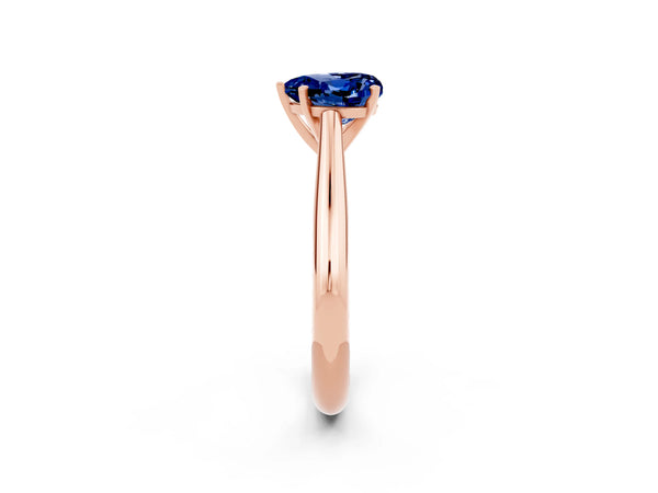 Rose gold Heart Cut Blue Sapphire Solitaire Engagement Ring with Cathedral Setting and Four-Prong Mount