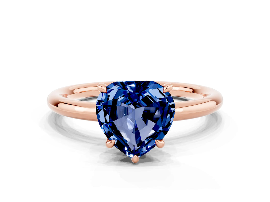 Rose gold Heart Cut Blue Sapphire Solitaire Ring with Thin Band and Four-Prong Setting