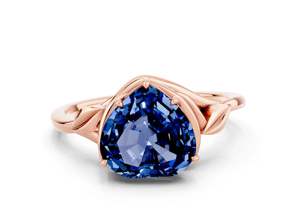 Rose gold Heart Cut Blue Sapphire Solitaire Ring with Twist Band and Four-Prong Setting