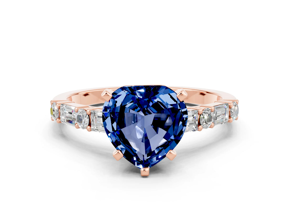 Rose gold Heart Cut Blue Sapphire Solitaire with Side Baguettes and Channel Set Band