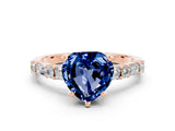 Rose gold Heart Cut Blue Sapphire Solitaire with Side Baguettes and Channel Set Band