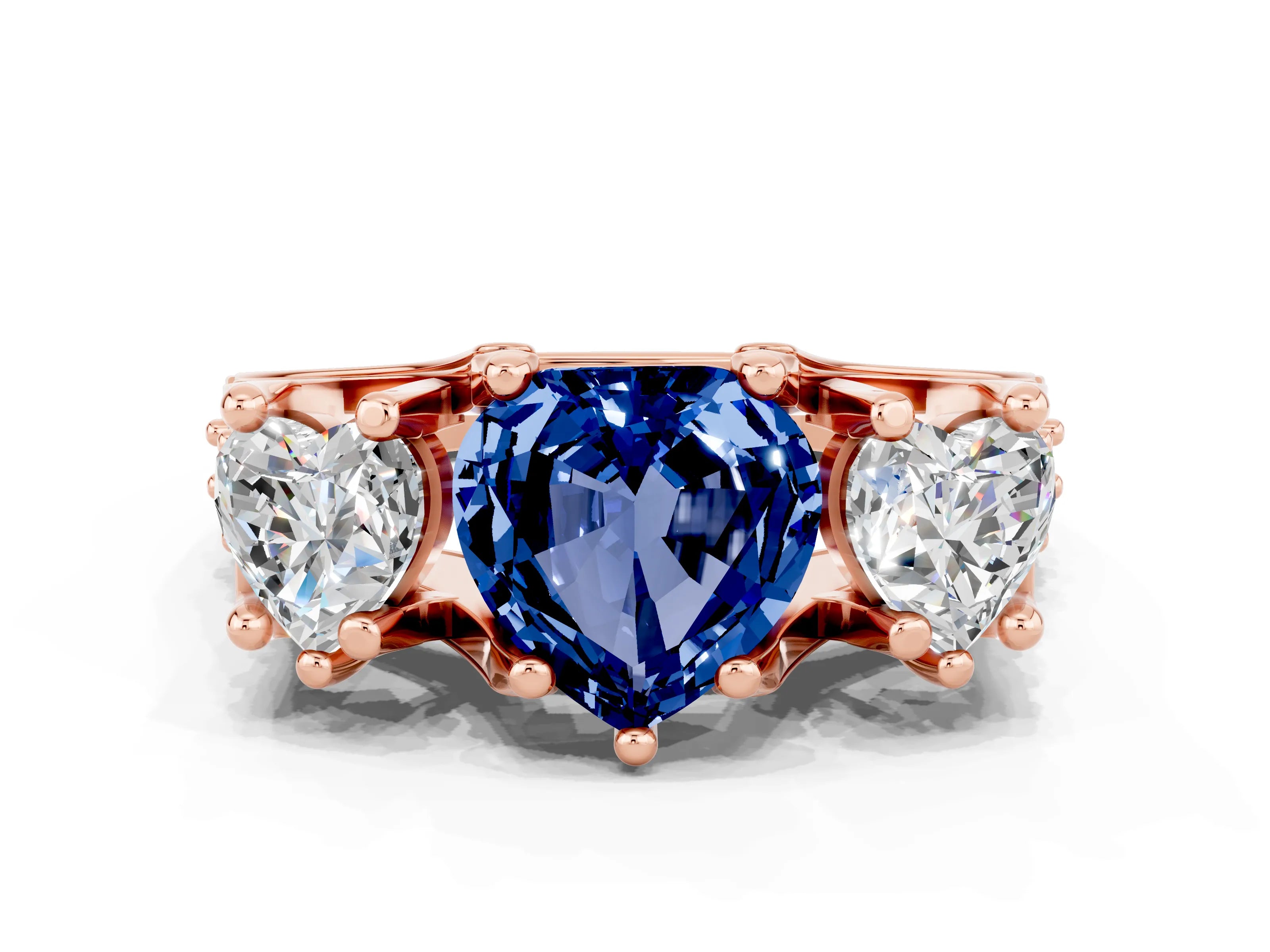 Rose gold Heart Cut Blue Sapphire Three-Stone Ring with Channel Set Band and Four-Prong Setting