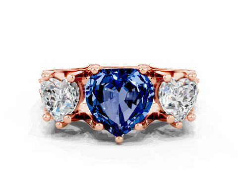 Rose gold Heart Cut Blue Sapphire Three-Stone Ring with Channel Set Band and Four-Prong Setting